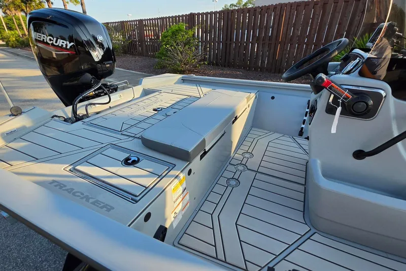 Slide: The Image of 2027 Tracker Bass Tracker 175 CC boat interior with Mercury engine, sleek design, and modern controls. - 18
