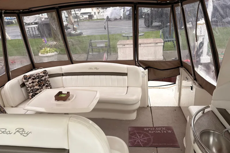 Slide: The Image of Luxurious interior of a 2007 Sea Ray 40 Sundancer yacht with plush seating and table. - 19