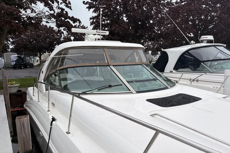 Slide: The Image of 2007 Sea Ray 40 Sundancer yacht docked, featuring sleek design and modern amenities. - 5