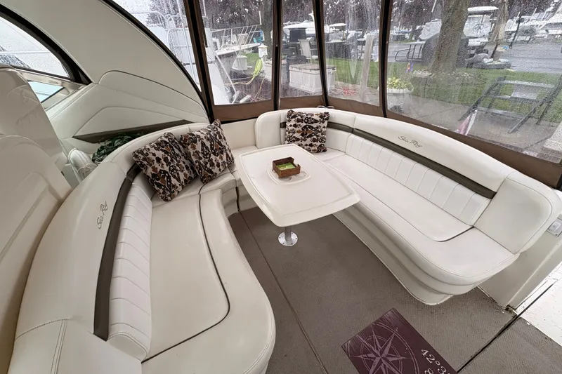 Slide: The Image of Luxurious 2007 Sea Ray 40 Sundancer yacht interior with elegant white seating and decorative pillows. - 22