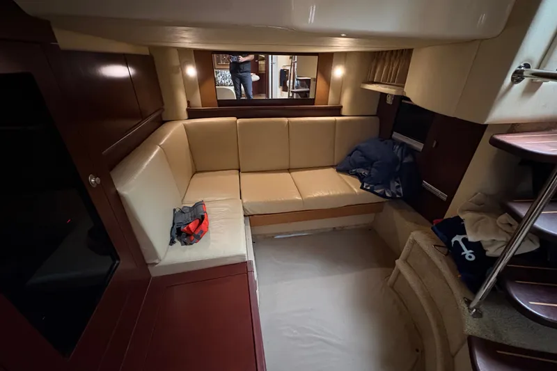 Slide: The Image of Interior of 2007 Sea Ray 40 Sundancer yacht with beige seating and wooden accents. - 15