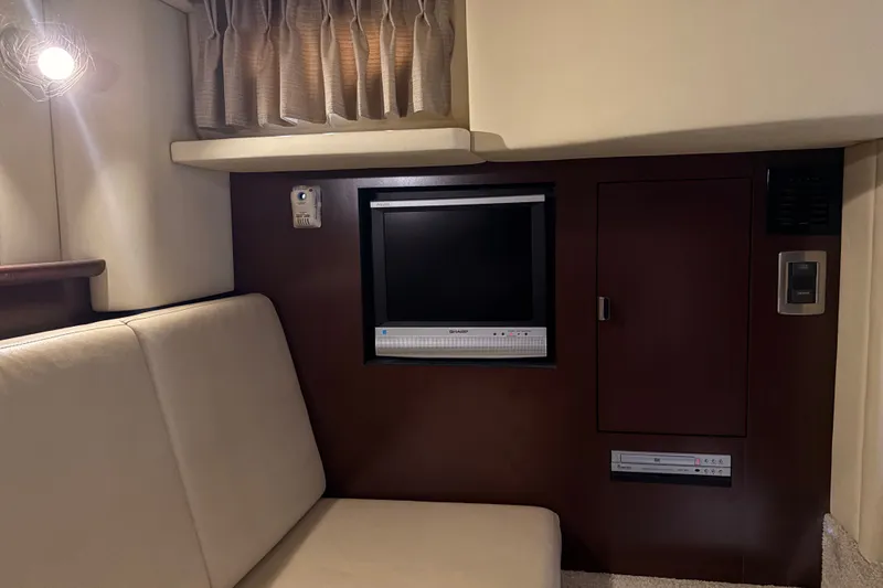 Slide: The Image of Interior of 2007 Sea Ray 40 Sundancer with TV and seating area. - 11