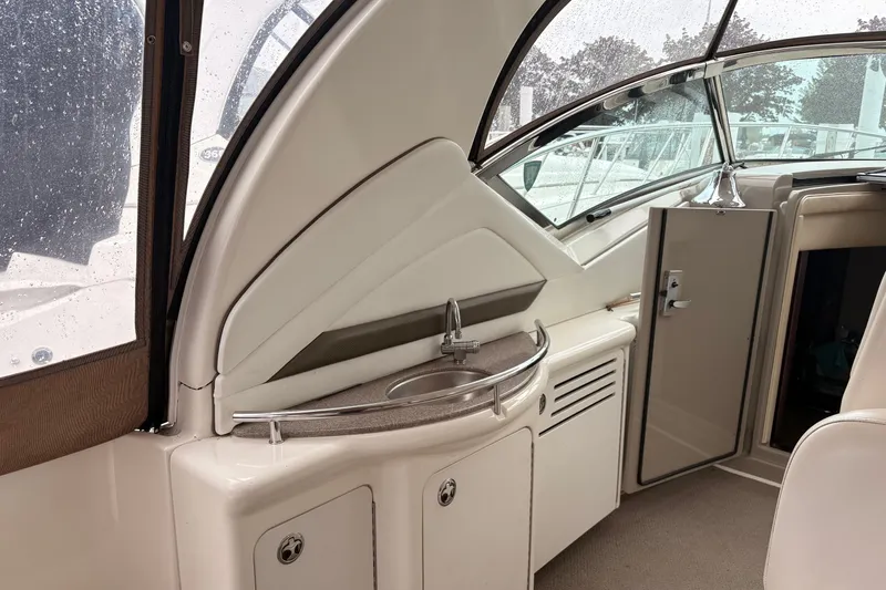 Slide: The Image of 2007 Sea Ray 40 Sundancer interior with sink and open cabin door. - 20