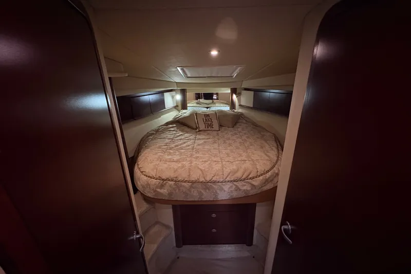 Slide: The Image of Luxurious cabin interior of 2007 Sea Ray 40 Sundancer yacht with cozy bedding. - 13