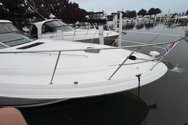 Slide: The Image of 2007 Sea Ray 40 Sundancer yacht docked at marina, showcasing sleek design and white exterior. - 4