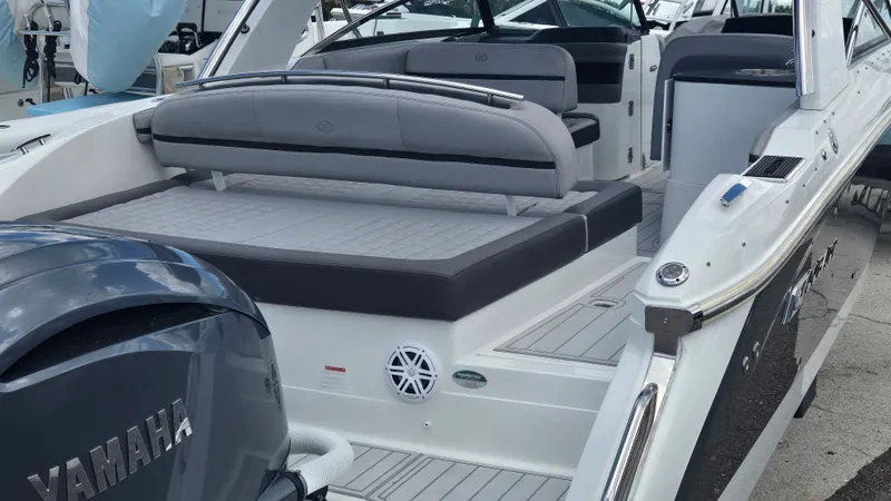 Slide: The Image of The image shows the stern of a 2023 Cobalt 30SC boat with gray upholstery. - 11