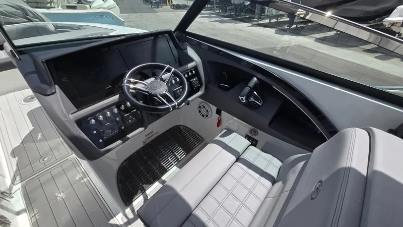Slide: The Image of The cockpit of the 2023 Cobalt 30SC features a modern steering wheel and digital displays. - 4