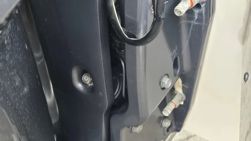 Slide: The Image of Close-up of a part of the Cobalt 30SC boat engine with visible bolts and wires. - 22