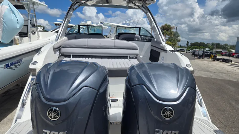 Slide: The Image of The image shows a 2023 Cobalt 30SC boat with two large outboard engines. - 21