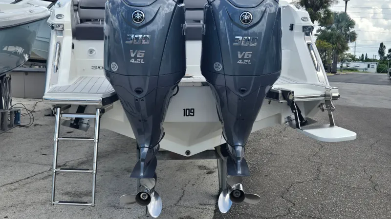 Slide: The Image of The image shows the stern of a 2023 Cobalt 30SC boat with two Yamaha outboard engines. - 19