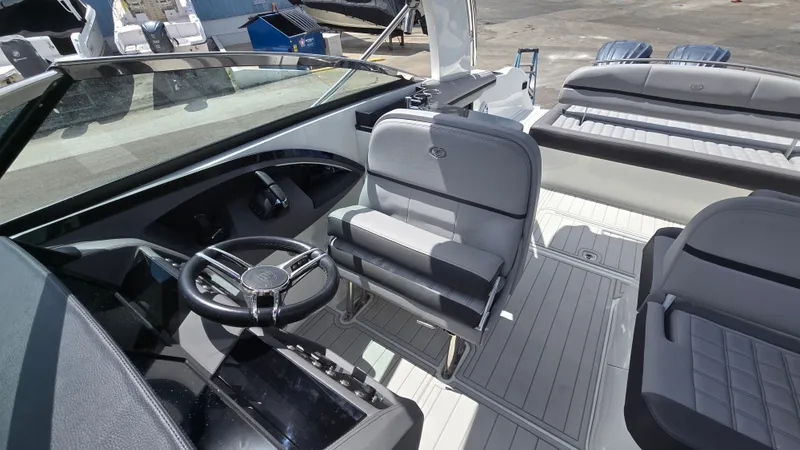 Slide: The Image of The image shows the cockpit of a 2023 Cobalt 30SC boat with modern seating and controls. - 5