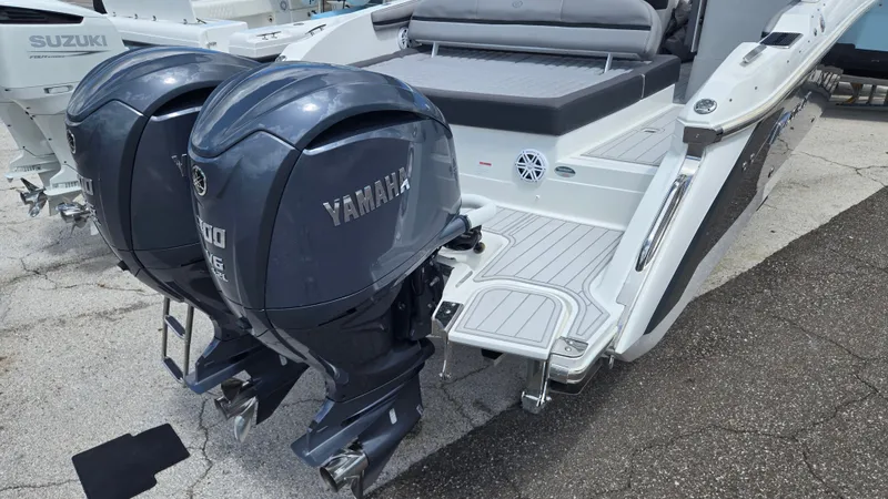 Slide: The Image of The image shows the stern of a 2023 Cobalt 30SC boat with two Yamaha outboard engines. - 20