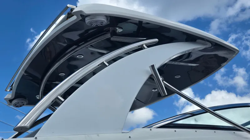 Slide: The Image of The image shows the sleek hardtop of a Cobalt 30SC boat against a blue sky. - 17