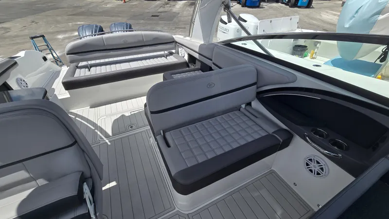 Slide: The Image of The image shows the cockpit of a 2023 Cobalt 30SC boat with gray upholstery and modern details. - 9