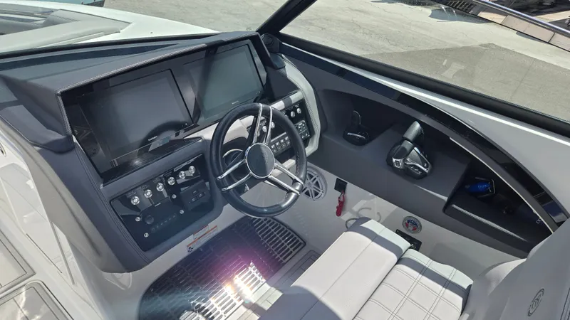 Slide: The Image of The 2023 Cobalt 30SC cockpit features a modern dashboard with dual screens and a sleek steering wheel. - 3