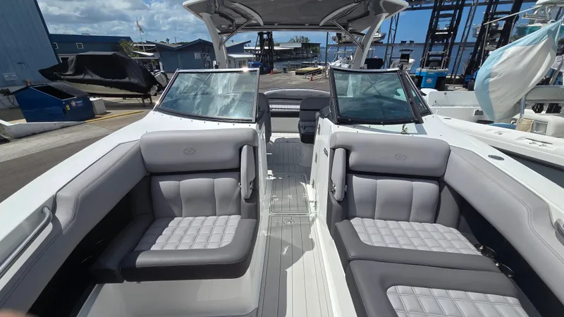 Slide: The Image of The image shows the cockpit of a 2023 Cobalt 30SC boat with luxurious seating. - 15
