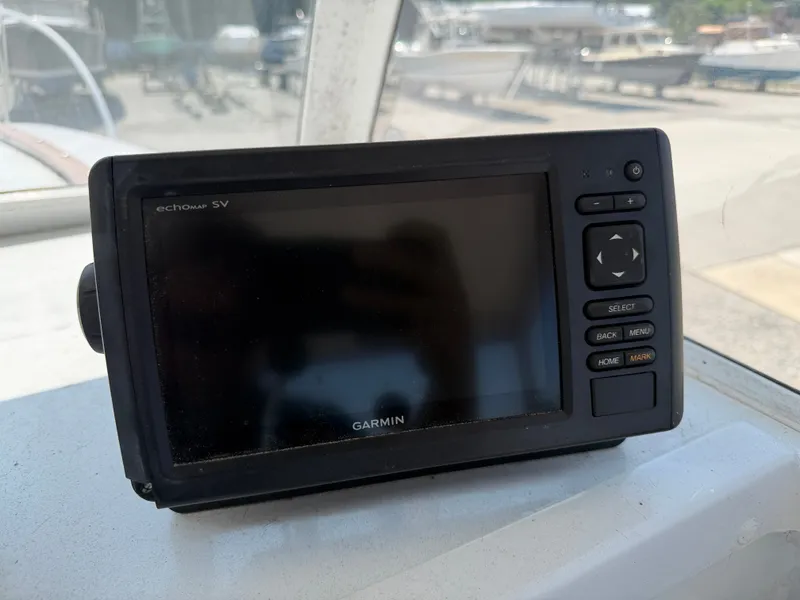 Slide: The Image of A Garmin echo sounder device is mounted on a boat. - 17