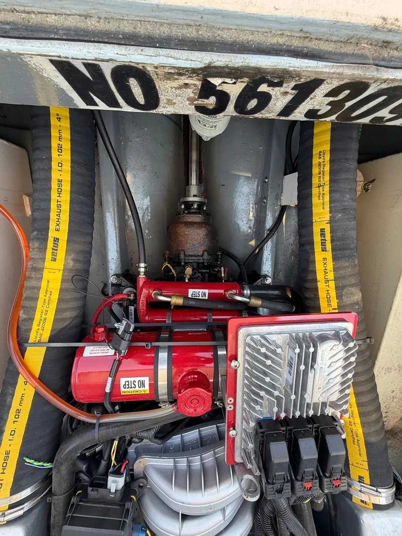 Slide: The Image of The engine compartment of a 1959 Dyer 29 Trunk Cabin shows a well-maintained engine. - 25