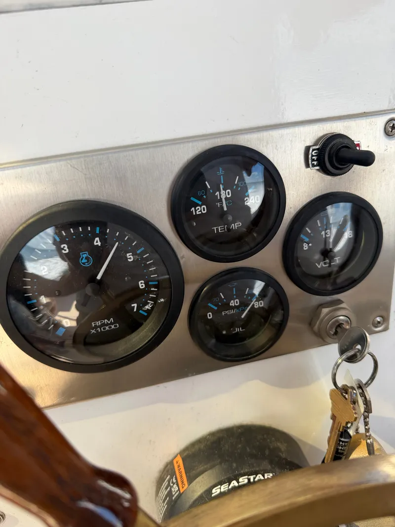 Slide: The Image of The image shows a dashboard with several round gauges and a switch. - 47