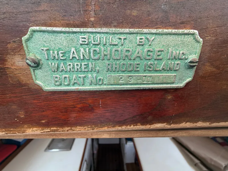 Slide: The Image of A metal plaque on wood shows the builder "The Anchorage Inc." from Warren, Rhode Island. - 22