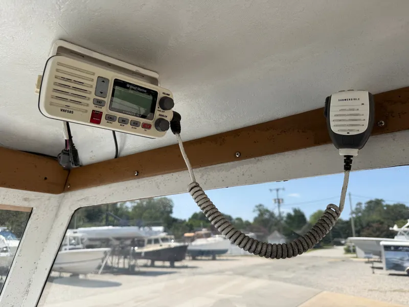 Slide: The Image of A radio is mounted on the ceiling of a boat cabin. - 18