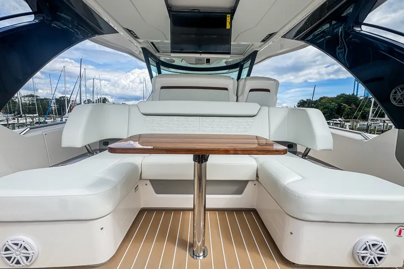 Slide: The Image of Luxurious interior of 2027 Tiara Yachts 39 LS with elegant seating and wooden table. - 18