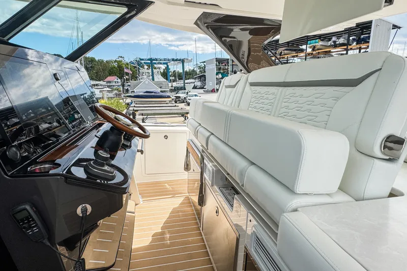 Slide: The Image of Luxurious interior of 2027 Tiara Yachts 39 LS with plush seating and modern helm. - 24