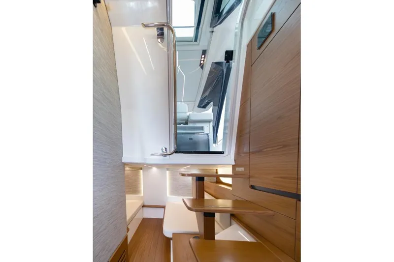 Slide: The Image of Interior view of 2026 Tiara Yachts 39, featuring modern wood finishes and sleek design. - 44