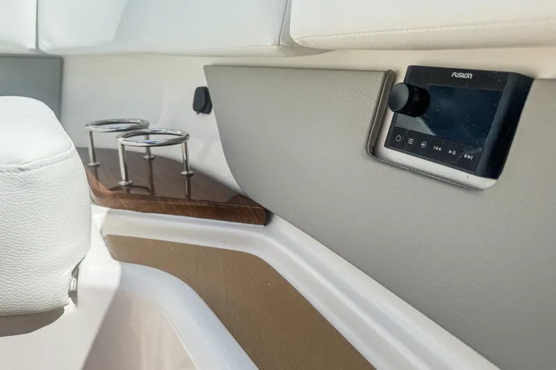 Slide: The Image of Interior of 2027 Tiara Yachts 39 LS featuring cup holders and audio controls. - 36