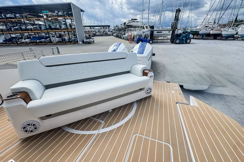 Slide: The Image of 2027 Tiara Yachts 39 LS with luxurious seating and modern design in a marina setting. - 31