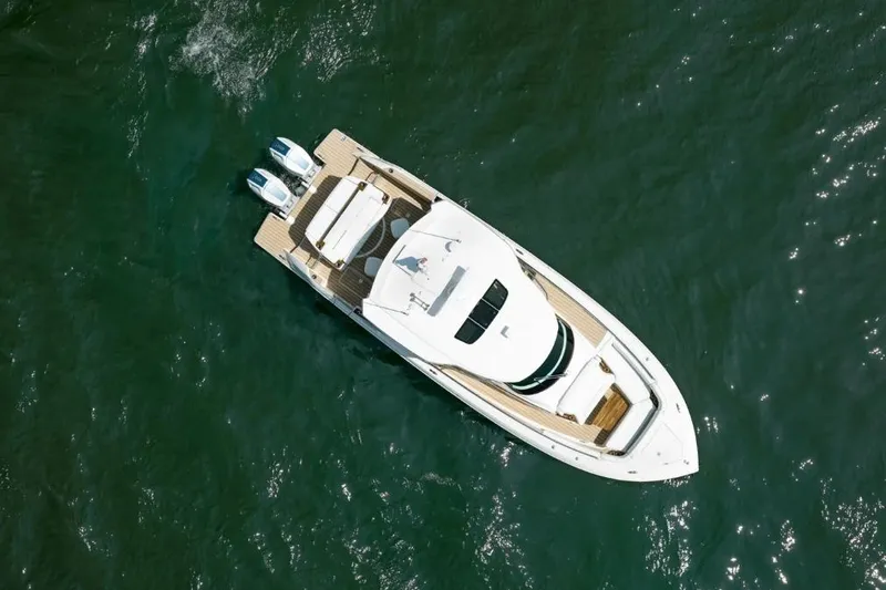 Slide: The Image of Aerial view of 2026 Tiara Yachts 39 on open water. - 1