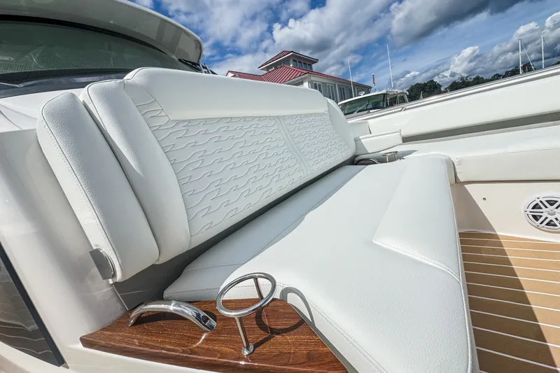 Slide: The Image of Luxurious seating on 2027 Tiara Yachts 39 LS, featuring elegant white upholstery and sleek design. - 13
