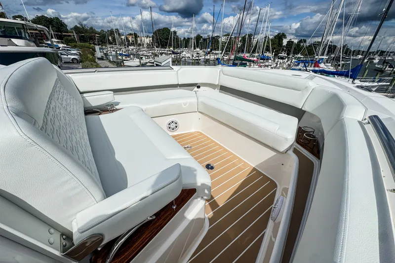 Slide: The Image of Luxurious seating area on 2027 Tiara Yachts 39 LS, docked at a marina. - 12