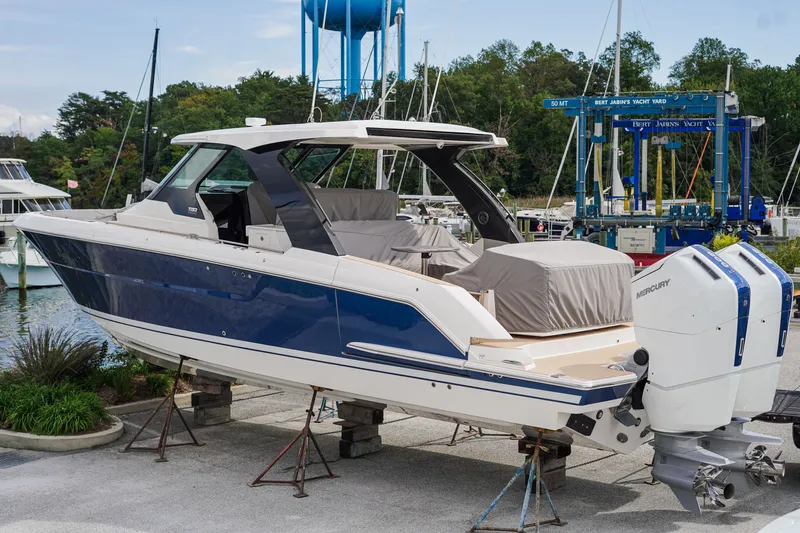 Slide: The Image of 2027 Tiara Yachts 39 LS with twin Mercury engines at a marina. - 6