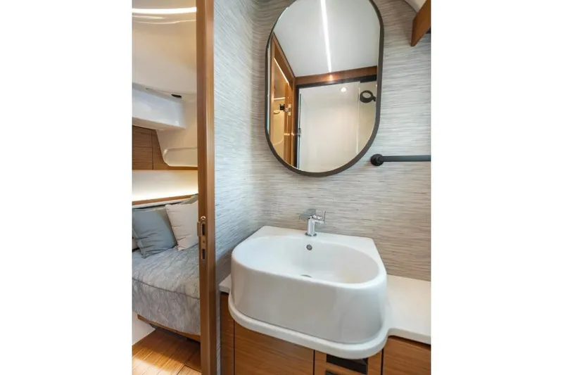 Slide: The Image of Luxurious bathroom interior of 2026 Tiara Yachts 39, featuring modern sink and mirror. - 42