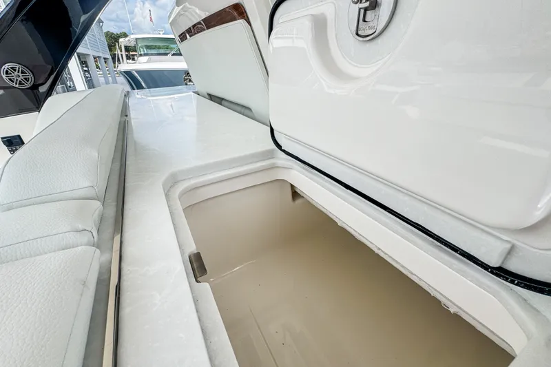 Slide: The Image of Open storage compartment on 2027 Tiara Yachts 39 LS, featuring sleek white interior design. - 22