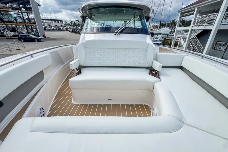 Slide: The Image of 2027 Tiara Yachts 39 LS boat interior with luxurious seating and sleek design. - 9