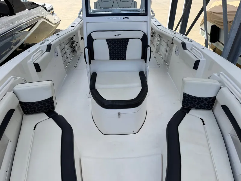 Slide: The Image of The image shows the cockpit of a 2021 Tidewater 272 CC Adventure with white and black seating. - 41