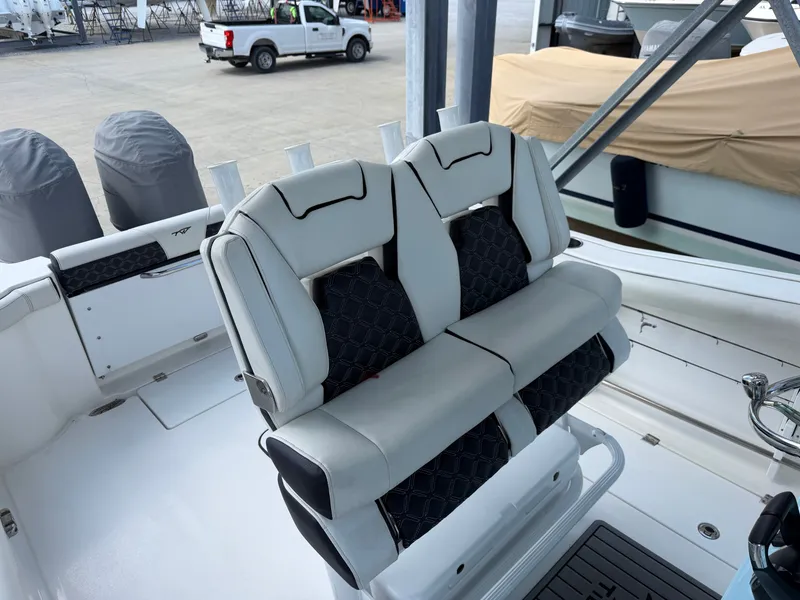 Slide: The Image of The 2021 Tidewater 272 CC Adventure features stylish, cushioned seats with a black and gray design. - 27