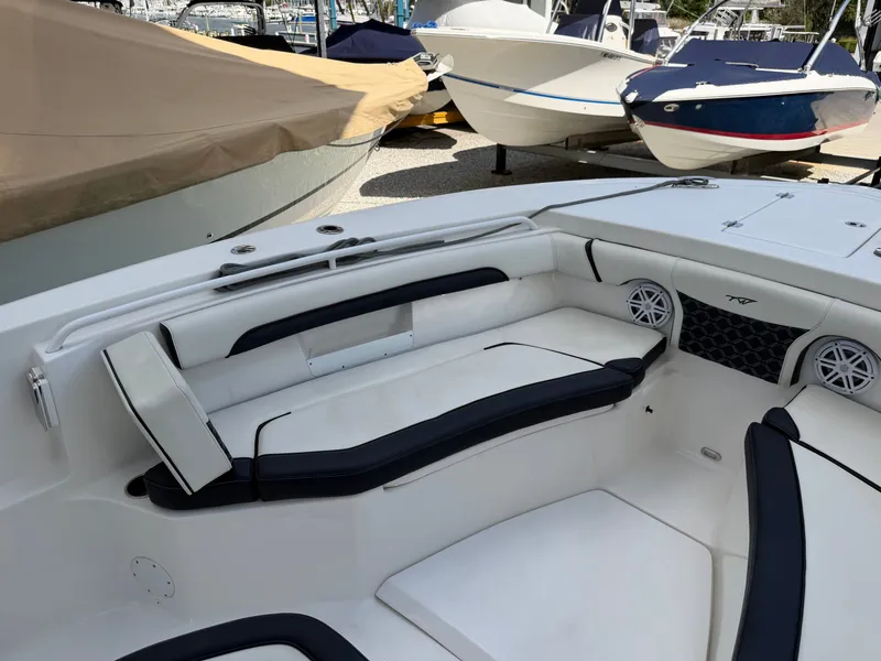 Slide: The Image of The image shows the cockpit of a 2021 Tidewater 272 CC Adventure boat with white and black seating. - 40