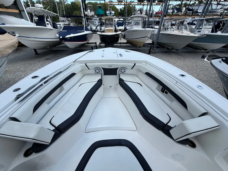 Slide: The Image of The image shows the bow area of a 2021 Tidewater 272 CC Adventure boat with cushioned seating. - 38