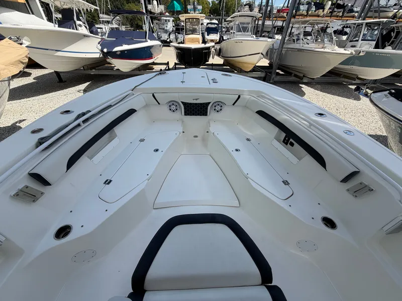 Slide: The Image of The image shows the spacious bow area of a 2021 Tidewater 272 CC Adventure boat. - 30