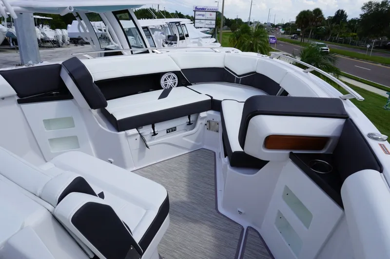 Slide: The Image of Luxurious seating area on the 2027 Monterey Elite 30 OB boat, featuring sleek design and comfort. - 20