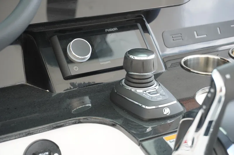 Slide: The Image of Control panel of 2027 Monterey Elite 30 OB boat with joystick and audio system. - 17
