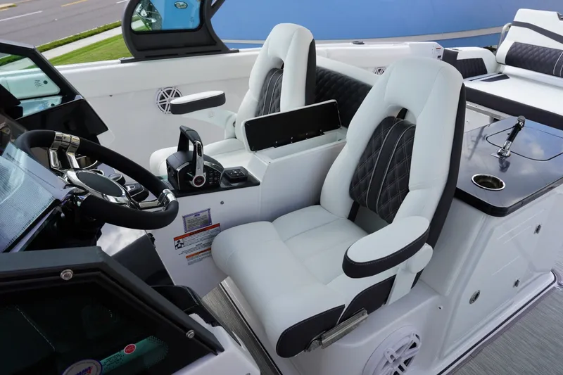 Slide: The Image of Luxurious cockpit of 2027 Monterey Elite 30 OB boat with modern controls and seating. - 15
