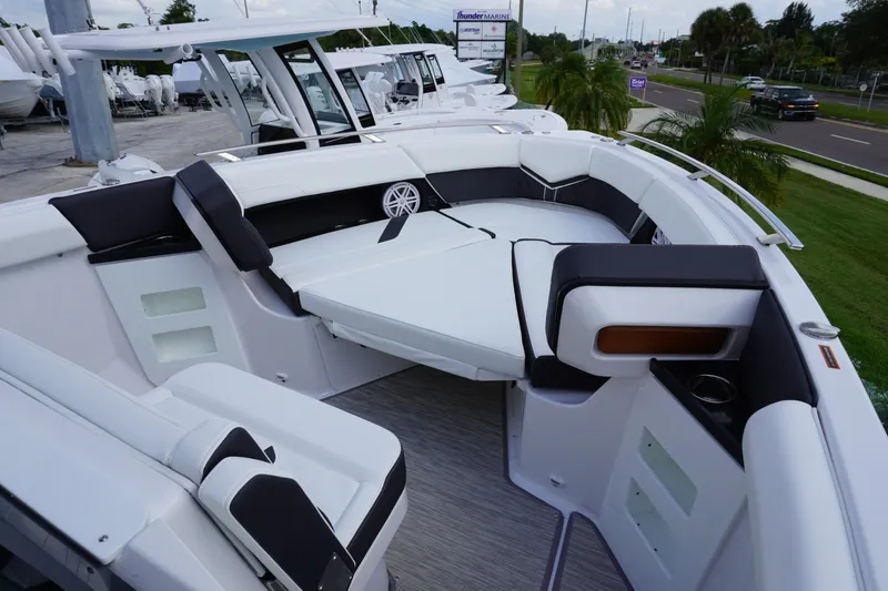 Slide: The Image of 2027 Monterey Elite 30 OB boat interior with luxurious seating and modern design. - 19