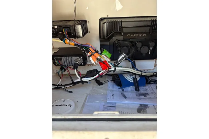 Slide: The Image of Interior electronics of a 2003 Contender 23 Open boat with Garmin equipment. - 10