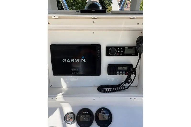 Slide: The Image of Dashboard of a 2003 Contender 23 Open boat with Garmin electronics and Yamaha gauges. - 6