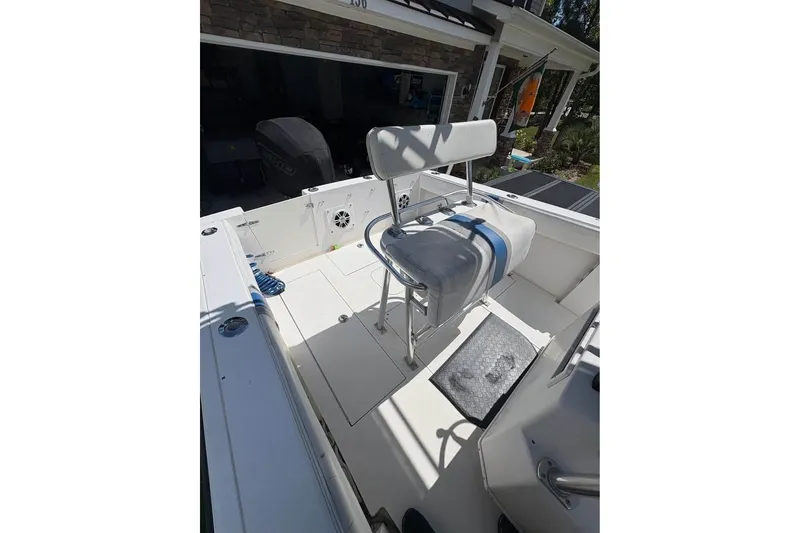 Slide: The Image of 2003 Contender 23 Open boat interior with seating and storage compartments. - 14
