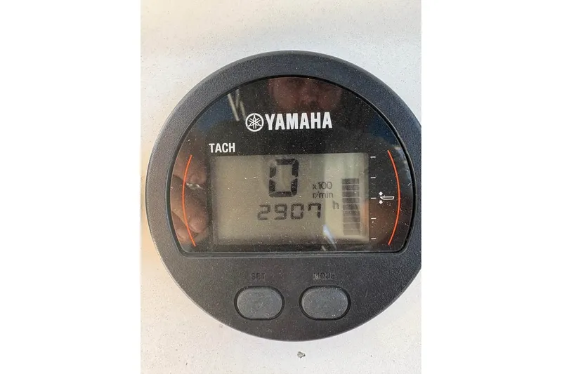 Slide: The Image of Yamaha tachometer displaying 2907 hours on a 2003 Contender 23 Open boat. - 7